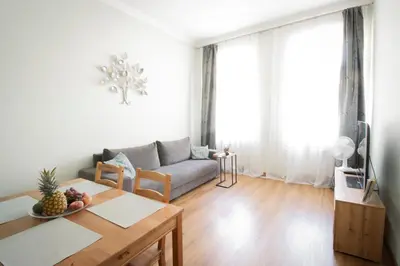 a living room with a couch and a table at Apartmán Anastasie in Prague