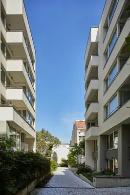 an empty street between two apartment buildings at Prague Days - Deluxe Apartments near Wenceslas Square in Prague