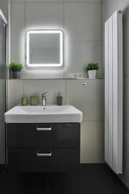 a bathroom with a white sink and a mirror at Prague Days - Deluxe Apartments near Wenceslas Square in Prague