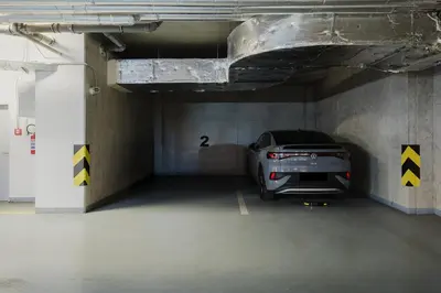 a parking garage with a car parked in it at Prague Days - Deluxe Apartments near Wenceslas Square in Prague