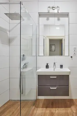 a bathroom with a sink and a shower at Prague Days - Deluxe Apartments near Wenceslas Square in Prague