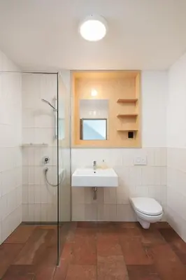 a bathroom with a sink and a shower and a toilet at Smilovický Mlýn in Rakovník
