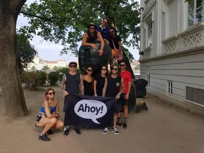 a group of people posing for a picture on an elephant at Ahoy! Hostel in Prague