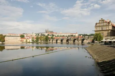 a bridge over a river in a city at Wishlist Prague Residences - Charles Bridge Karlova in Prague