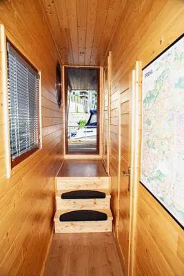 a small room with a window and a map on the wall at Houseboat Bonanza Prague in Prague
