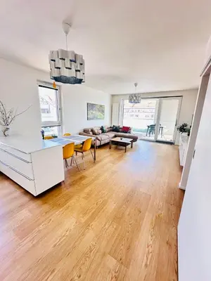 a living room with a couch and a table at Nová Nuselská in Prague