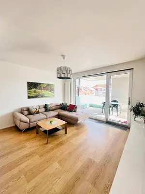 a living room with a couch and a table at Nová Nuselská in Prague