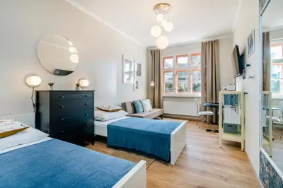 a bedroom with two beds and a mirror at Prague Days - Bright Apartments - Fast WiFi - Quiet Area in Prague