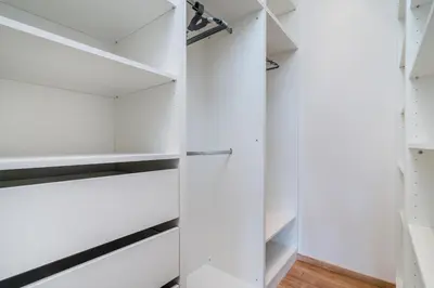 a kitchen and living room with a bowl of fruit on a counter at Prague Days - Bright Apartments - Fast WiFi - Quiet Area in Prague