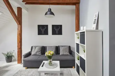 a living room with a dresser and a mirror at Prague Days - Bright Apartments - Fast WiFi - Quiet Area in Prague