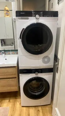a washer and dryer with its door open in a kitchen at Anenska by Charles Bridge 2 in Prague
