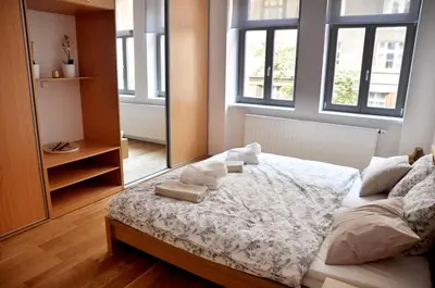 a dining room with a table and chairs at Family Apartments in Prague