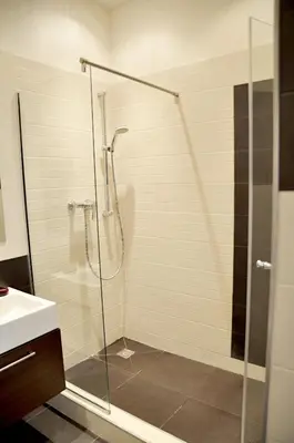 a bedroom with a bed with towels on it at Family Apartments in Prague