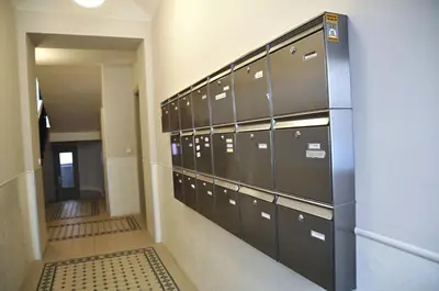 an elevator door in a building with windows at Family Apartments in Prague