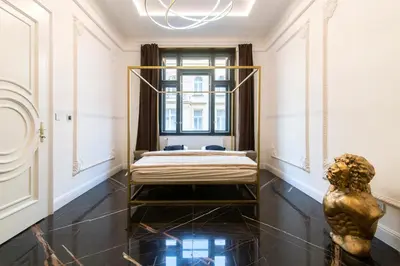 a bedroom with a bed and a window at Antique Glam Apartment in Old Town Prague in Prague