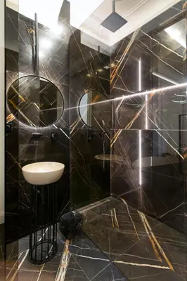 a black bathroom with a sink and a mirror at Antique Glam Apartment in Old Town Prague in Prague