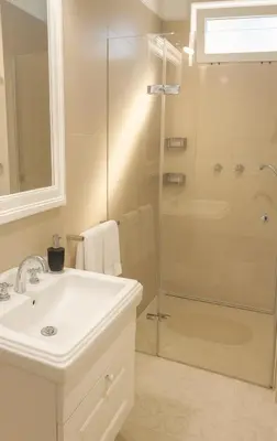 a bathroom with a sink and a shower at Wishlist Prague Residences Malá Strana in Prague