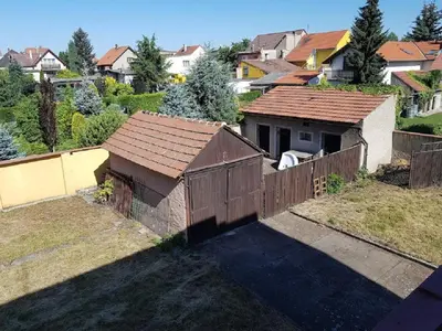 an aerial view of a house with a fence at Rodinný dům pod Hazemburkem in Libochovice