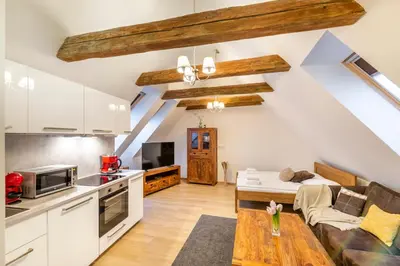a kitchen and living room in a loft at Masná 20 - Old Town Residence in Prague