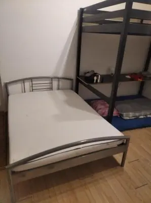 a bunk bed in a room with a ladder at Economy flat 18 minutes from Vaclavske namesti in Prague
