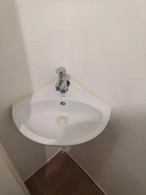 a white sink in a white room with at Economy flat 18 minutes from Vaclavske namesti in Prague