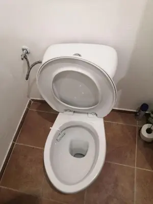a bathroom with a white toilet in a room at Economy flat 18 minutes from Vaclavske namesti in Prague