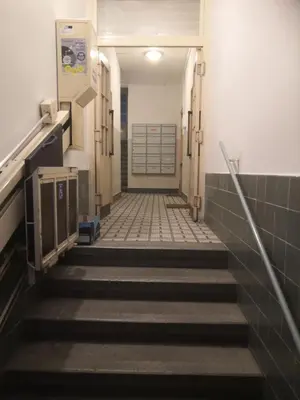 a hallway with stairs and a door in a building at Economy flat 18 minutes from Vaclavske namesti in Prague