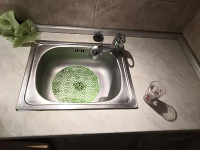 a sink with a faucet in a bathroom at Economy flat 18 minutes from Vaclavske namesti in Prague
