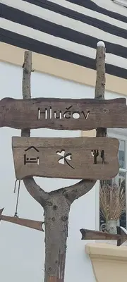 a wooden sign with the word livingjoy on it at Hlučov Lesní Chalupa in Kokořín
