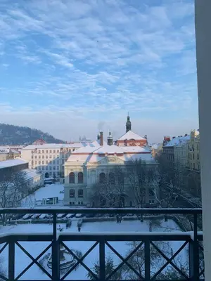 a view of a city with snow covered buildings at Beautiful view on the Prague castle close to the centre in Prague