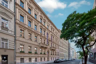 a large building on the side of a street at Aparthotel Rimska 14 in Prague
