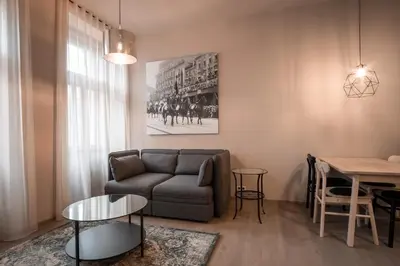 a living room with a couch and a table at Aparthotel Rimska 14 in Prague