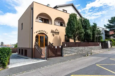 a building with a gate in front of it at Wine Pension Prague in Prague