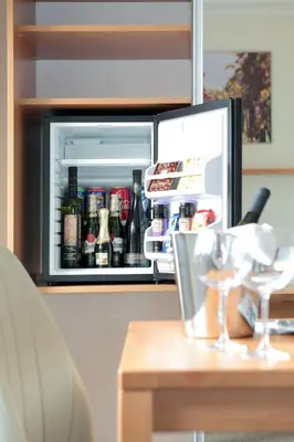 an open refrigerator filled with lots of drinks at Wine Pension Prague in Prague