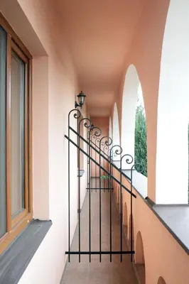 a staircase in a building with a window at Wine Pension Prague in Prague