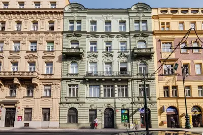 a large building on the corner of a street at Charles Bridge - 3 bedroom Apartment - Old Town in Prague