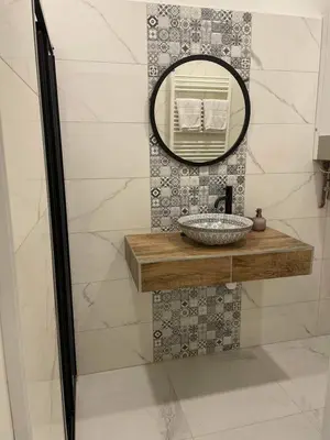 a bathroom with a sink and a mirror at Nice and cozy apartment right at TV tower in Prague