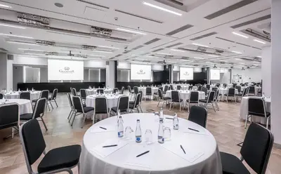 a conference room with white tables and chairs at Grandior Hotel Prague in Prague