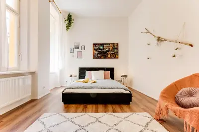 a bedroom with a bed in a room with white walls at Spacious cozy 2bds apt in center - stp4 in Prague