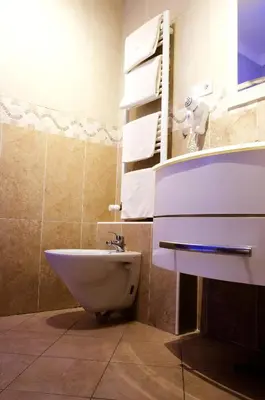 a bathroom with a sink and a toilet at Dolce Vita Suites Boutique in Prague