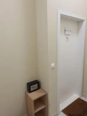 a small radio sitting on a wooden stand in a room at Get Prague Flat Stepanska in Prague