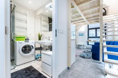 a laundry room with a washer and dryer at Get Prague Flat Stepanska in Prague