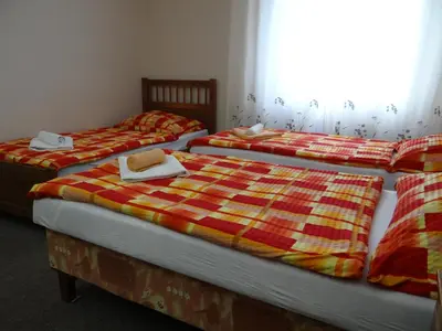 two beds sitting next to each other in a room at Pension Europa in Prague