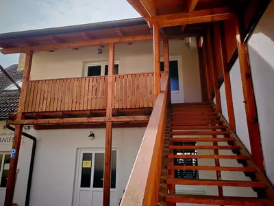 a wooden staircase leading up to a house at apartmán Sázava in Sázava