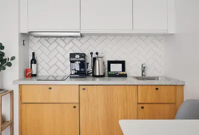 a kitchen with a counter top with a coffee maker at TurnKey I Downtown Studio in Prague