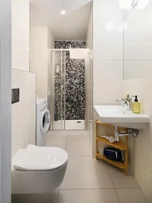 a bathroom with a toilet and a sink and a shower at TurnKey I Downtown Studio in Prague