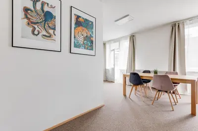 a dining room with a table and chairs at Riben House Prague in Prague