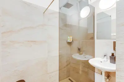 a bathroom with a sink and a mirror at Riben House Prague in Prague