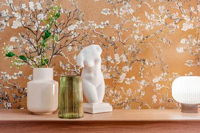 a shelf with two vases and a statue on it at TurnKey I Main Bus Station Apartments in Prague