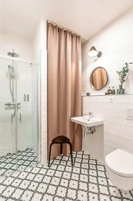 a bathroom with a shower and a sink and a toilet at TurnKey I Main Bus Station Apartments in Prague